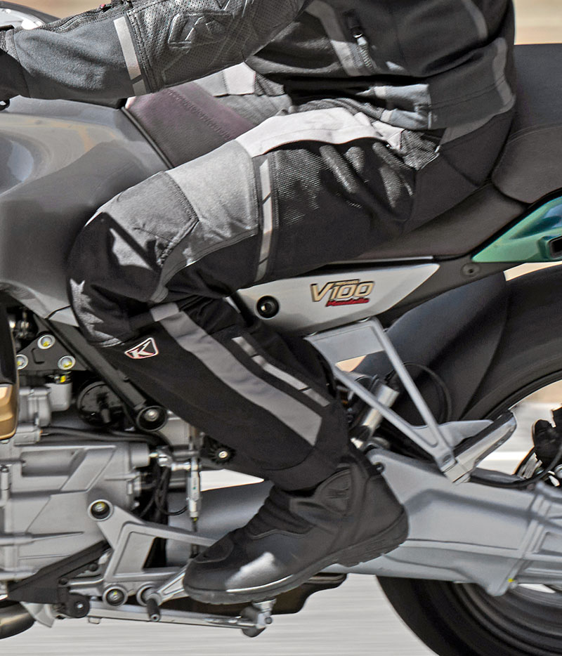 Guy wearing Klim Induction pant on Guzzi V100
